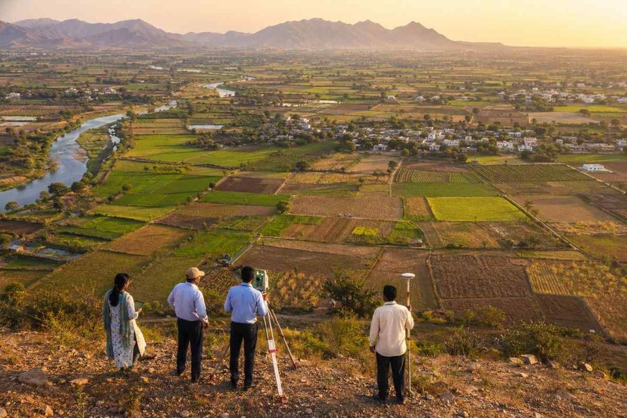 survey-team-panoramic-farmland-river-view